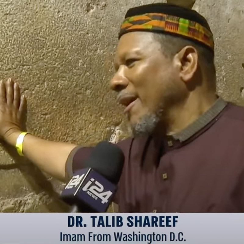 Image of imam Talib Shareef being interviewed